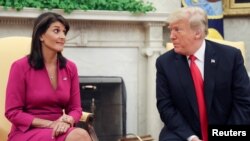 U.S. President Trump meets with U.N. Ambassador Haley in the Oval Office of the White House in Washington...