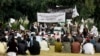 FILE - Students gather as some raise Taliban and Islamic State flags in Jalalabad, Afghanistan, Nov. 8, 2015. 