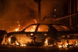 A car burns near the Third Police Precinct on May 27, 2020 in Minneapolis, Minnesota.
