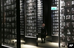 A visitor looks at an exhibit in the Museum of the Second World War, an ambitious new museum under creation for nine years has opened its doors for a day to historians, museums and reporters in Gdansk, Poland, Jan. 23, 2017.