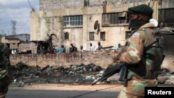 Members of the military patrol through the streets of Alexandra township as the country deploys the army to quell unrest linked to the jailing of former President Jacob Zuma, in Johannesburg, South Africa, July 15, 2021. 
