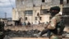 FILE - Members of the military patrol through the streets of Alexandra township as the country deploys the army to quell unrest linked to the jailing of former President Jacob Zuma, in Johannesburg, South Africa, July 15, 2021. 