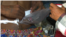 Vann Sophea, a trash collector, was shot by an identified driver in a Lexus car, shows his wound to VOA Khmer at his home on February 1, 2016. (Pin Sisovann/VOA Khmer)