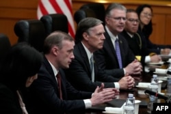 U.S. national security adviser Jake Sullivan, second from left, speaks as he sits next to U.S. Ambassador to China Nicholas Burns during a meeting with Vice Chairman of the Central Military Commission Zhang Youxia, not pictured, in Beijing on Aug. 29, 2024.