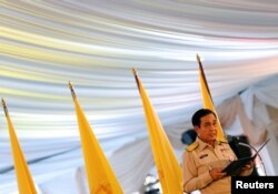 Thailand's Prime Minister Prayut Chan-o-cha gives an opening speech during the dinner for rescue workers and volunteers who participated in the cave rescue earlier this year, in Bangkok, Sept. 6, 2018.