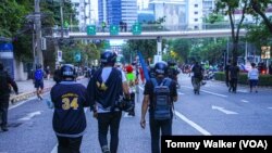 FILE - Journalists covering street demonstrations in Bangkok, Thailand, Nov. 14, 2021.