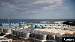 FILE - Storage tanks for radioactive water are seen at Tokyo Electric Power Co's tsunami-crippled Fukushima Daiichi nuclear power plant in Okuma town, Fukushima prefecture, Japan, Feb. 18, 2019. 