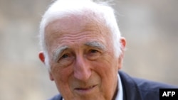 FILE - Founder of the Communaute de l'Arche (Arch community) Jean Vanier, 86, poses at home in Trosly-Breuil, Sept. 23, 2014. In an internal inquiry released Feb. 22, 2020, Vanier, who passed away in 2019, is accused of sexual abuse by several women.
