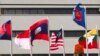 Bendera negara-negara anggota ASEAN berkibar di Gedung Sekretariat ASEAN di Jakarta, 22 April 2021. (AP Photo/Tatan Syuflana)