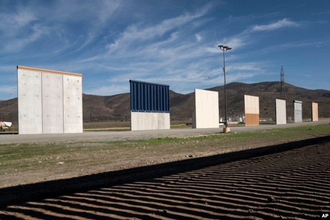 Border wall prototypes stand in San Diego near the Mexico-U.S. border, seen from Tijuana, Dec. 22, 2018.