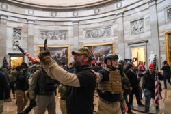 Supporters of US President Donald Trump enter the US Capitol's Rotunda