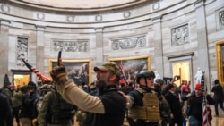 Supporters of US President Donald Trump enter the US Capitol's Rotunda