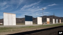 Wall prototypes sit on the US-Mexico border
