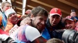Alexander Tretiakov of Russia celebrates with fans and supporters in the finish area after he won the gold medal during the men&#39;s skeleton competition, Krasnaya Polyana, Russia, Feb. 15, 2014.