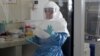 A laboratory specialist examines specimens of the Ebola virus at the Uganda virus research centre in Entebbe, 40km (25 miles) south from capital Kampala, May 17, 2011. 