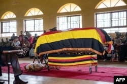 Attendees and family members pay respects at the funeral of 33-year-old Ugandan marathon runner Rebecca Cheptegei at the community hall in Bukwo village, Uganda, on September 14, 2024.