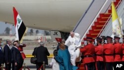 Pope Francis arrives at Baghdad's international airport, Iraq, Friday, March 5, 2021. Pope Francis heads to Iraq on Friday to urge the country's dwindling number of Christians to stay put and help rebuild the country after years of war and…