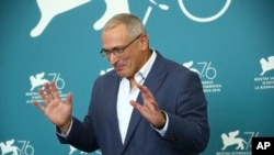Russian oligarch Mikhail Khodorkovsky poses for photographers at the photo call for the film 'Citizen K' at the 76th edition of the Venice Film Festival in Venice, Italy, Aug. 31, 2019. 