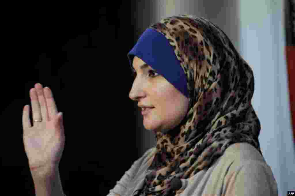 Linda Sarsour, director of the Arab American Association of New York, poses for photos at the association's headquarters in the Brooklyn borough of New York, Thursday, Dec. 29, 2011. Sarsour is one of the civic and religious leaders who signed a letter de