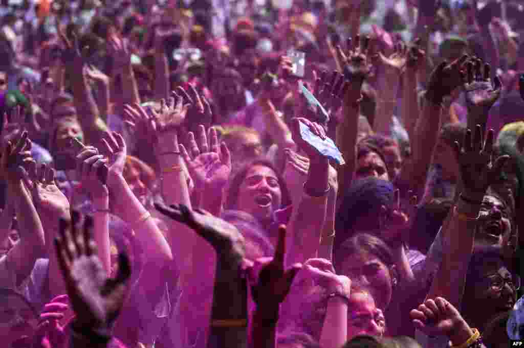 People gdance as they take part in the Color Festival at Kadikoy district in Istanbul, Turkey.