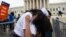 Jackelin Alfaro, 7, of Washington hugs her aunt Gelin Alfaro, of Veracruz, Mexico, during an immigration rally at the Supreme Court in Washington, June 23, 2016.