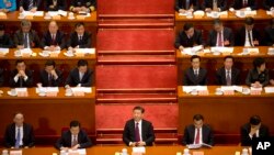 Chinese President Xi Jinping (center) listens during the opening session of the Chinese People's Political Consultative Conference in Beijing's Great Hall of the People, March 3, 2017. The head of China's legislative advisory body, Yu Zhengsheng, said Ch