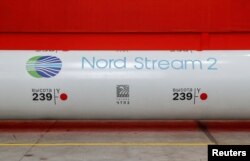 FILE - The logo of the Nord Stream 2 gas pipeline project is seen on a large diameter pipe at the Chelyabinsk Pipe Rolling Plant owned by ChelPipe Group in Chelyabinsk, Russia, Feb. 26, 2020.