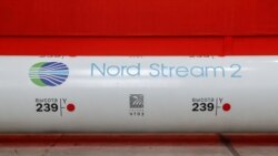 FILE - The logo of the Nord Stream 2 gas pipeline project is seen on a large diameter pipe at the Chelyabinsk Pipe Rolling Plant owned by ChelPipe Group in Chelyabinsk, Russia, Feb. 26, 2020.