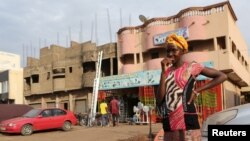 FILE - A girl waits to cross a street in Bamako, Mali, April 11, 2016.