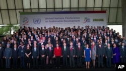 Presidents and other officials stand for a group picture at the United Nations Conference on Sustainable Development in Rio de Janeiro, Brazi. 