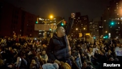 Protesters gather in Manhattan as thousands take to the streets of New York demanding justice for the death of Eric Garner, Dec. 5, 2014.