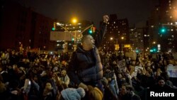 Protesters gather in Manhattan as thousands take to the streets of New York demanding justice for the death of Eric Garner, Dec. 5, 2014.