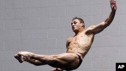 Troy Dumais dives in the men's three-meter springboard final at the US Olympic diving trials in Federal Way, Washington, June 24, 2012.