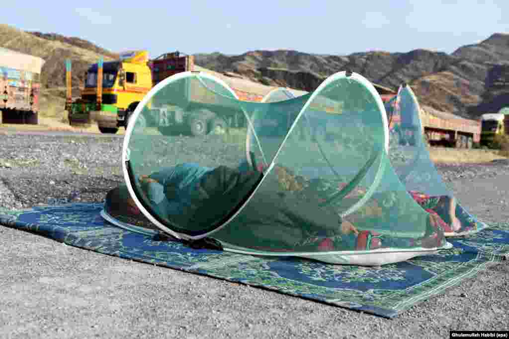 People stranded at Pakistan-Afghanistan borders, also known as the Durand Line, wait for its opening in Toorkham, Afghanistan. Hundreds of people from across the borders were stranded on either sides after talks between Pakistani and Afghan officials failed to follow a disagreement over the installation of barbed wire and putting up fences in Pakistani territory.