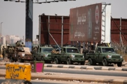 Sudanese security forces are deployed during a protest a day after the military seized power Khartoum, Sudan, Oct. 26, 2021.