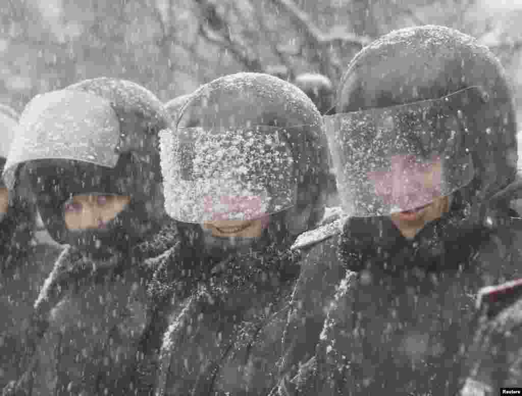 Ukrainian police officers stand in line during protests in Kyiv, Dec. 6, 2013.&nbsp;