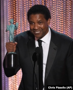 Denzel Washington accepts the award for outstanding performance by a male actor in a leading role for "Fences" at the 23rd annual Screen Actors Guild Awards at the Shrine Auditorium & Expo Hall on Sunday, Jan. 29, 2017, in Los Angeles.