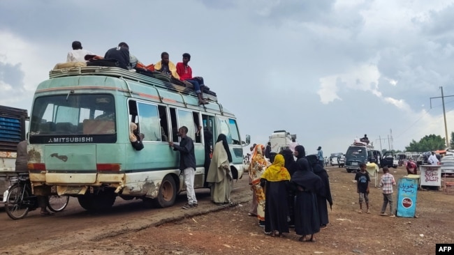 People displaced from eastern areas of Sudan's al-Jazira state arrive to Gedaref city on Oct. 27, 2024.