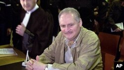 Venezuelan international terrorist Carlos the Jackal, foreground, whose real name is Ilich Ramirez Sanchez, sits in a Paris courtroom. (File)