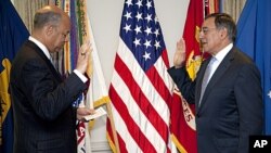 Leon Panetta is sworn is as Defense Secretary Pentagon General Counsel Jeh Johnson, at the Pentagon, July 1, 2011