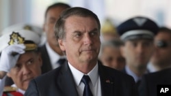 Brazil's President Jair Bolsonaro arrives at the Naval Club in Brasilia, Brazil, Jan. 9, 2019. Overhaul of the costly state pension system is a top priority for the country's new president.