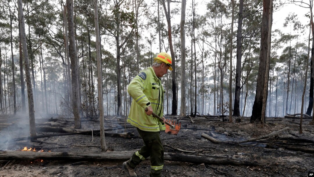 Forestry Corporation worker Dale McLean patrols a controlled fire at a wildfire near Bodalla, Australia, Jan. 12, 2020.