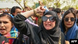 Pakistan's former prime minister Imran Khan's supporters protest outside the court in Islamabad on June 27, 2024, to demand the release of Khan and his wife Bushra Bibi.