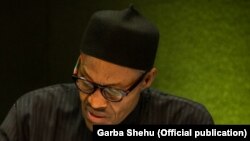 Shugaba Muhammadu Buhari, Shugaban Tarayyar Afirka Mai ci, a lokacin da ya ke jawabi a zauren taron