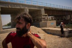 Abdullah, 33 years old and the father of five children, says he is still afraid of IS coming back to Raqqa, Syria, Aug. 25, 2019. (Yan Boechat/VOA)