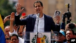 Juan Guaido, head of Venezuela's opposition-run congress, declares himself interim president of Venezuela, during a rally demanding President Nicolas Maduro's resignation in Caracas, Venezuela, Jan. 23, 2019.