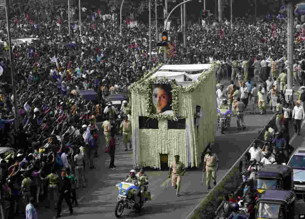 The body of Indian actress Sridevi is carried in a truck during her funeral in Mumbai. Thousands of mourning fans paid their respects to the iconic Bollywood actress who drowned accidentally in a Dubai hotel bathtub over the weekend.