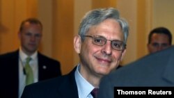 U.S. Supreme Court nominee Judge Merrick Garland walks after a breakfast with Senate Judiciary Committee Chair Senator Chuck Grassley (R-IA) on Capitol Hill Washington.