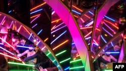 Star Wars fans display their light sabres to mark a “May the 4th be with you“ event, at the Taipei 101 commercial building, the tallest in Taiwan, in Taipei on May 4, 2021.