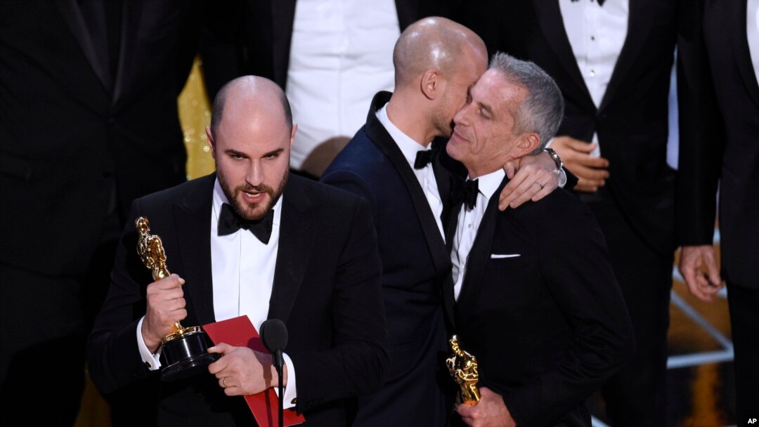 Jordan Horowitz, left, of "La La Land," mistakenly accepts the award for best picture at the Oscars on Sunday, Feb. 26, 2017, at the Dolby Theatre in Los Angeles. It was later determined that "Moonlight," won best picture. (Photo by Chris